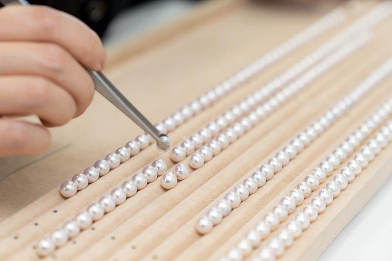 Pearl strands being sorted and graded